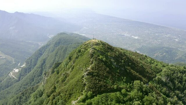Sea coast and Apuane Mountains with Carrara white marble caves in Versilia