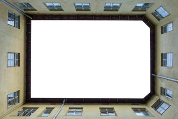 The frame around the empty billboard is formed by parts of the wall of the house with windows. Mockup.