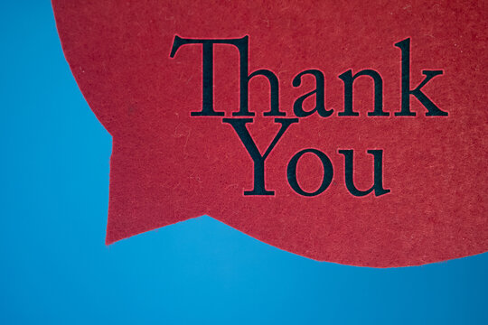 Speech bubble in front of colored background with Thank You text.