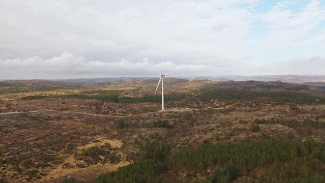 One wind turbine producing electricity in Lindesnes windfarm Norway - Aerial showing turbine operated by Asko Fornybar AS in southern Norway - Aerial