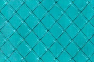 The metal surface is reinforced with metal strips attached with rivets as background, texture, pattern.