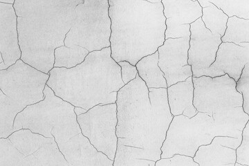 Cracks in the gray wall look like lightning.