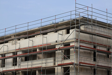 building under construction with scaffolding