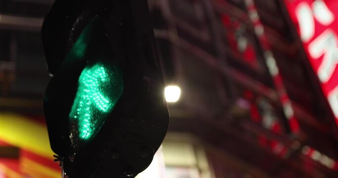 A night traffic light in Shinjuku rainy day handheld