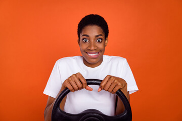 Photo of short hair stylish androgyne lady driver bite teeth lips steering wheel travel isolated...