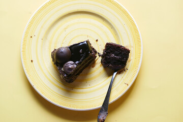 chocolate and cream cake on a plate on table 