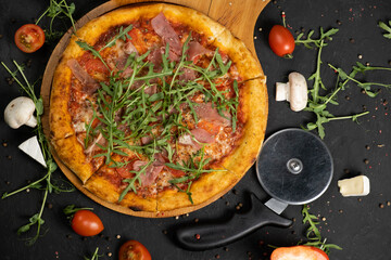 Pizza with prosciutto and cheese. Top view. Free copy space.