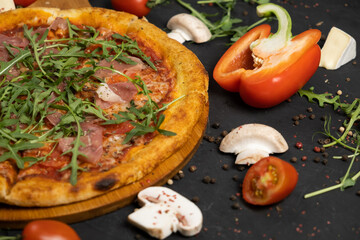 Pizza with prosciutto and cheese. Top view. Free copy space.
