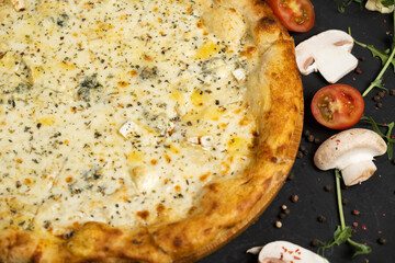 Pizza with cheese on a black background. Khachapuri