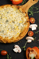 Pizza with cheese on a black background. Khachapuri