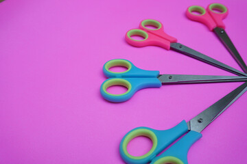 colorful scissors isolated on blue