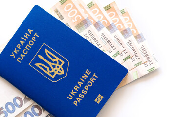 Ukrainian biometric passport. Ukrainian international passport with money isolated on a white background.