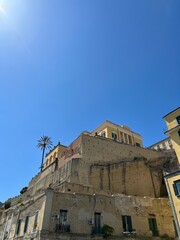 Fototapeta na wymiar Buildings on the rock in Naples Italy