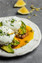 Sandwich with avocado and Poached Egg. Wholemeal Bread Toast sliced avocado and egg with cup of coffee for healthy breakfast or snack, copy space.