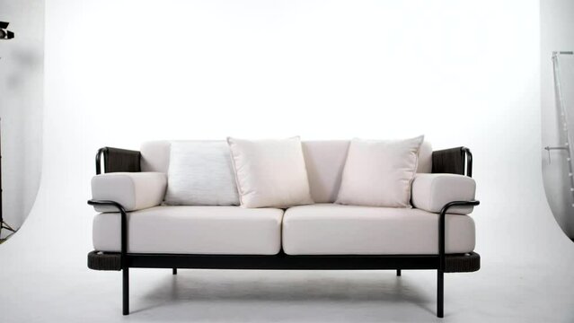 Stylish exterior sofa with light upholstery on a white background 