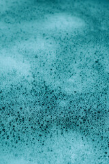blue foamy water close-up. white bubbles