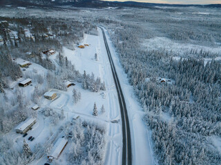 snow view of a road and houses