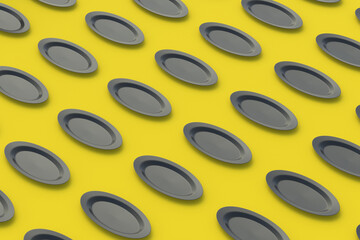 Pattern of black oval plates on yellow background. 3d render