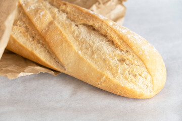 White loaf in paper 	on a white background