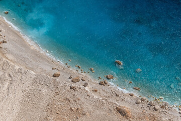 Fototapeta na wymiar Crystal clear blue waters near Keri Beach in Zakynthos, Greece.