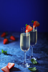 Two glasses of champagne with strawberry