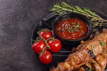 Shish kebab from the grill with fresh tomatoes and hot chili sauce with herbs