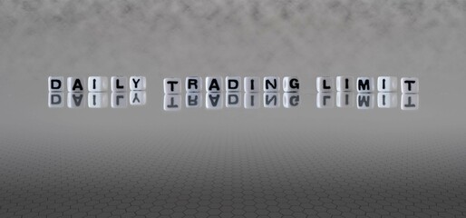 daily trading limit word or concept represented by black and white letter cubes on a grey horizon...