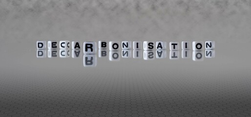 decarbonisation word or concept represented by black and white letter cubes on a grey horizon...