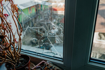 broken window by Russian invaders in Irpin