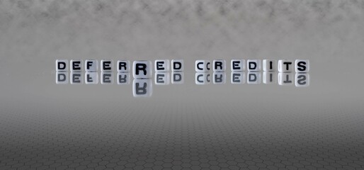 deferred credits word or concept represented by black and white letter cubes on a grey horizon...