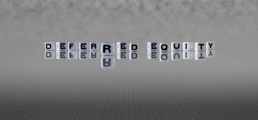 deferred equity word or concept represented by black and white letter cubes on a grey horizon...