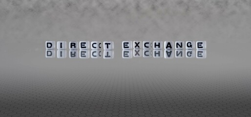 direct exchange word or concept represented by black and white letter cubes on a grey horizon...