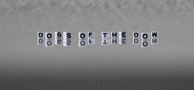 dogs of the dow word or concept represented by black and white letter cubes on a grey horizon background stretching to infinity