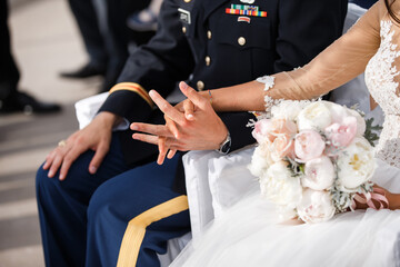 Newly wed couple's hands at the ceremony