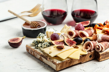Cheese platter. Assorted cheese, wine ham, fruit, bread sticks, nuts. banner, menu, recipe place...