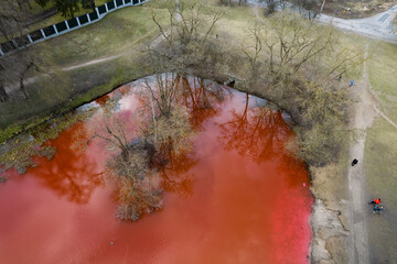 Aerial view of bloody red dyed pond in Vilnius near Russian embassy, Lithuania