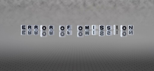 error of omission word or concept represented by black and white letter cubes on a grey horizon...
