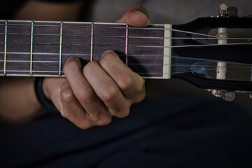 fingers on D chord close up