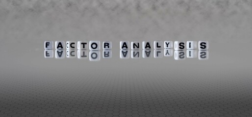 factor analysis word or concept represented by black and white letter cubes on a grey horizon background stretching to infinity