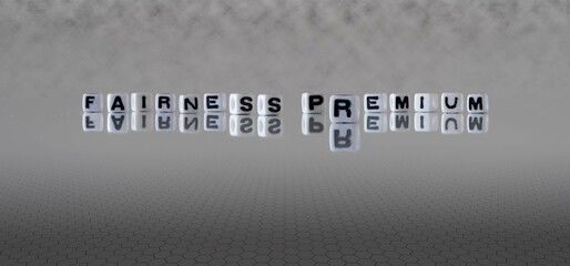 fairness premium word or concept represented by black and white letter cubes on a grey horizon...
