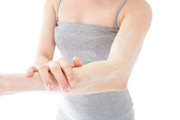 Young woman using a sunscreen cream