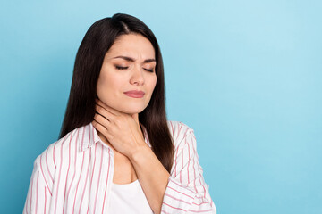 Obraz premium Portrait of attractive ill long-haired girl touching neck feeling bad corona isolated over blue pastel color background