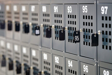 Storage cells for personal things. Key type safe storage locker for shopping malls, storage cabinet. Numbered storage box in public place. Cells with metal locks, key with number.