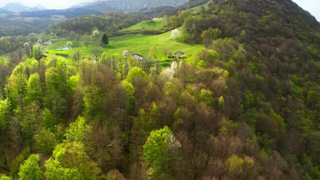 Aerial video of the small town of Pasturo in Lombardy, North Italy showing mountain panorama, forest and old cottages in the small village. Footage 4k, drone view