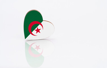 Flag of Algeria in the shape of a heart on a white background. The concept of patriotism. copyspace.