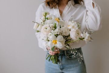 Girl holding a bouquet of flowers for the holiday