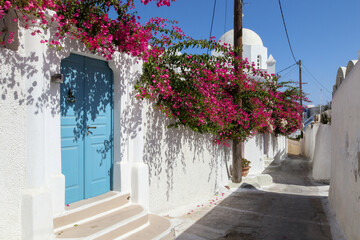 Blue door with bougainvillea, Santorini Island, Greece