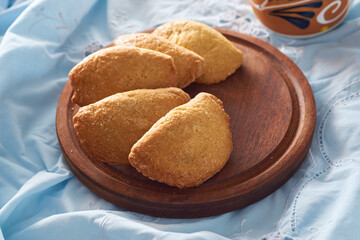 latin american baked sweet empanadas with dulce de leche