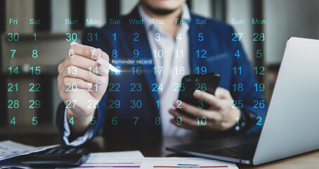 Concept of business planning, business people holding smartphone and mark note at calendar on...