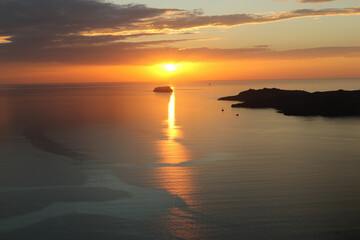 Sunset over the Sea of Crete with boats, Santorini, Greece